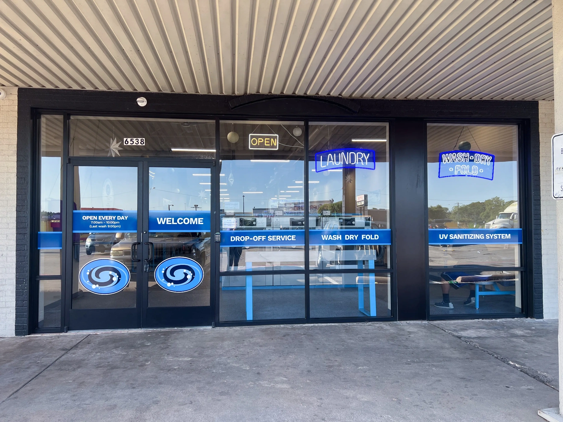 WaveMAX Fort Worth wash and fold storefront with LUX UV sanitizing system signage